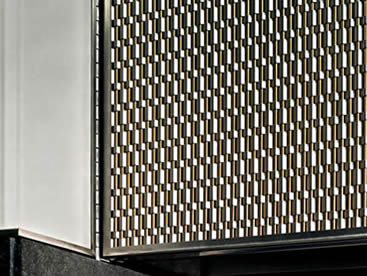 Stainless steel and brass type architectural rigid mesh is installed on the facade of building.