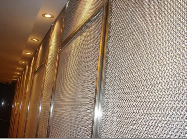 The cable metal mesh is covering the wall in the office building.