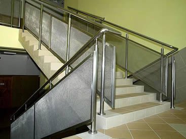 The cable metal meshes are installed on the handrails in the stairs.