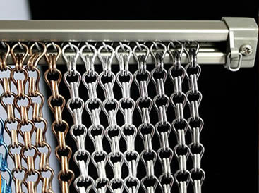 Four different colors of aluminum chain curtains are installed on the track.