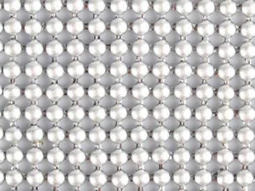 A piece of metallic fabric cloth with round shapes.